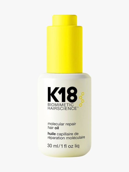 K18 Molecular Repair Hair Oil white bottle with modern yellow dropper cap on light gray background