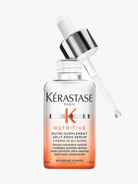 Kérastase Nutritive Hydrating Split Ends Serum clear to orange gradient serum bottle with silver and white dropper cap ajar on light gray background