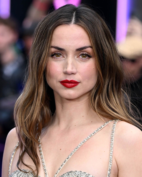 ana de armas with brownsugar brunette hair  fall hair color trends 2025
